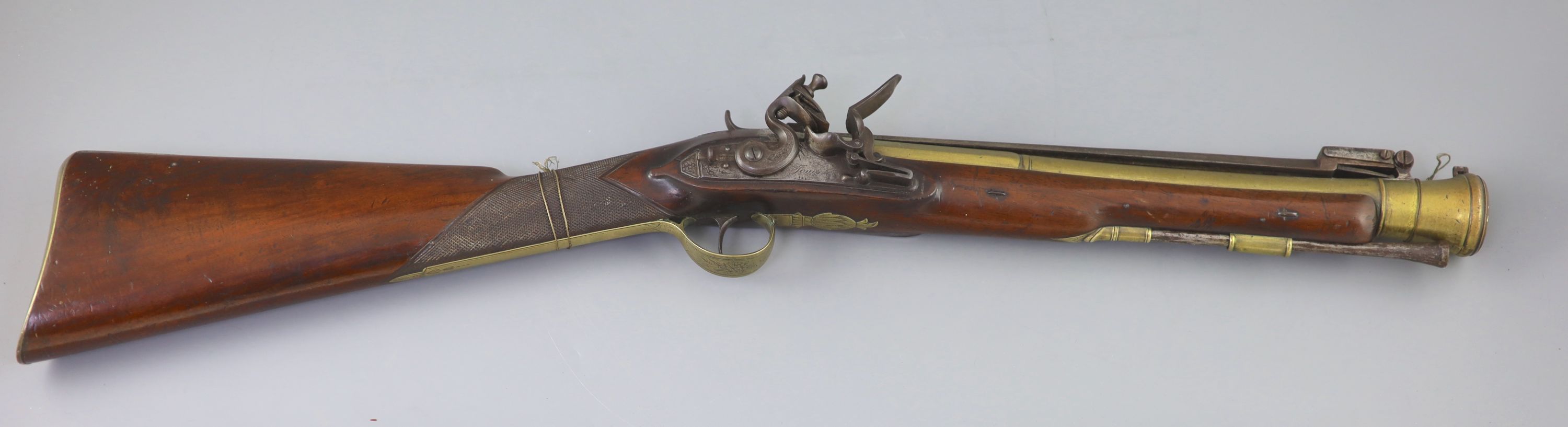 A late 18th century brass barrelled flintlock blunderbuss, by Jones, length 30in.